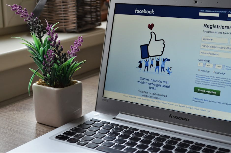 Marketing employee reviewing a social media account alert on a laptop