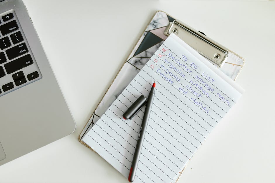 Professional reviewing a cybersecurity compliance checklist at their desk