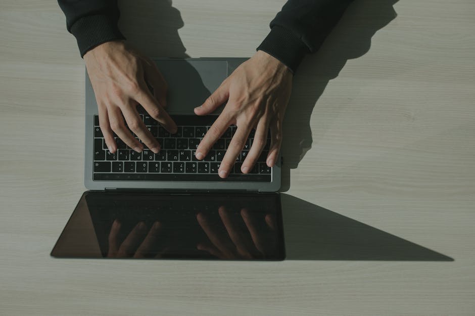 Security team reviewing a suspicious compliance email on a laptop
