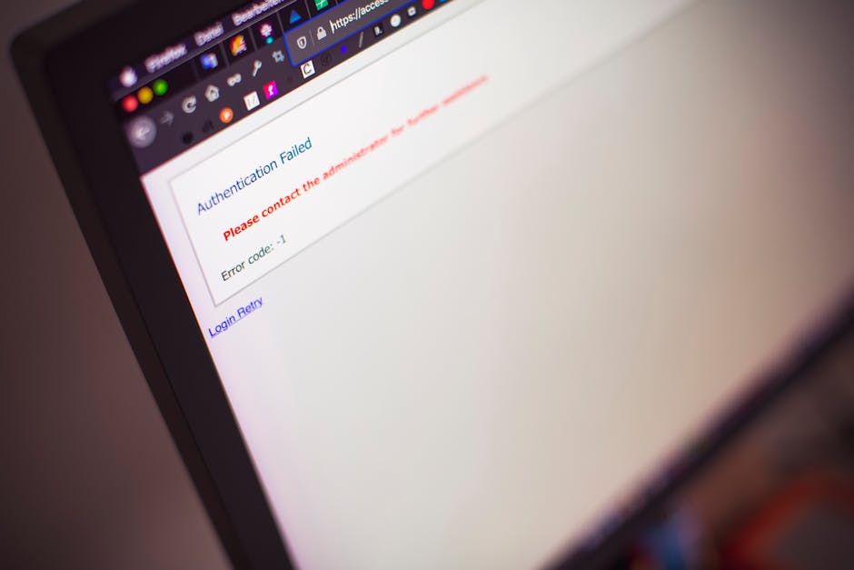 Security analyst reviewing a suspicious device login code on a laptop