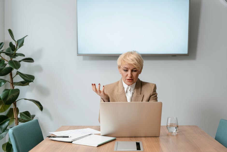 Finance professional on a video conference call reviewing a wire transfer request