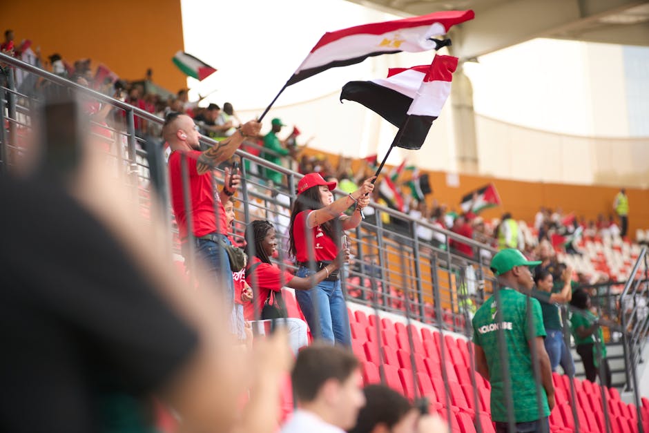 Football fans filling a packed stadium during a major tournament match