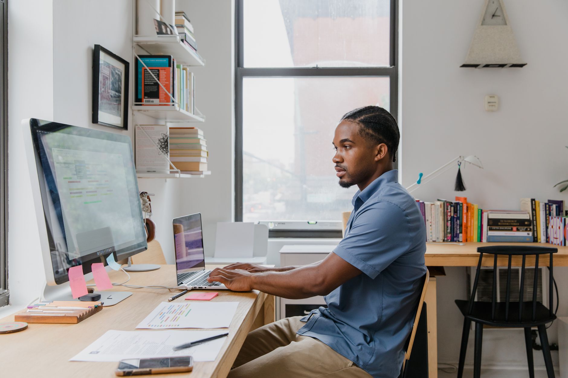 Small business owner working confidently at a computer in a modern office