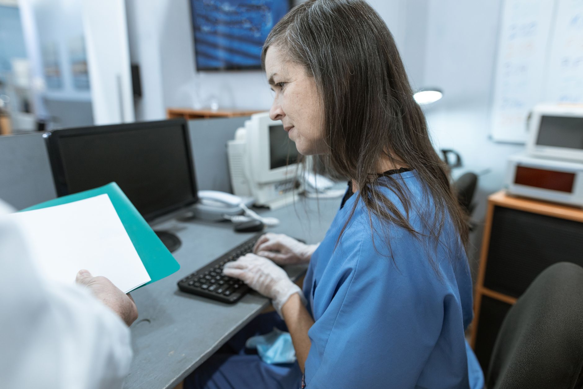 Hospital staff working at computer workstations subject to HIPAA Security Rule requirements