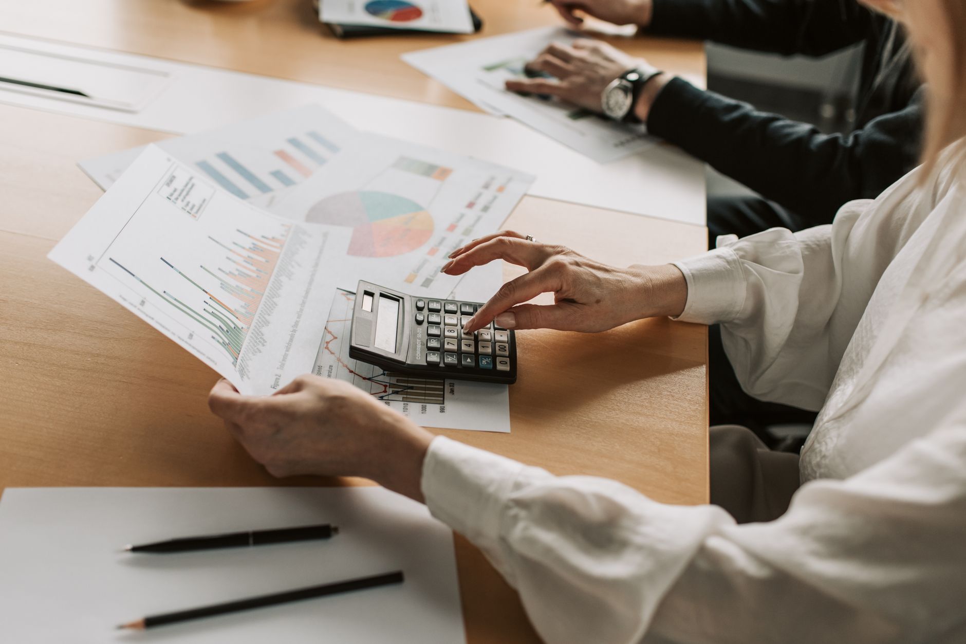 Finance and security leaders reviewing budget charts during an annual planning meeting