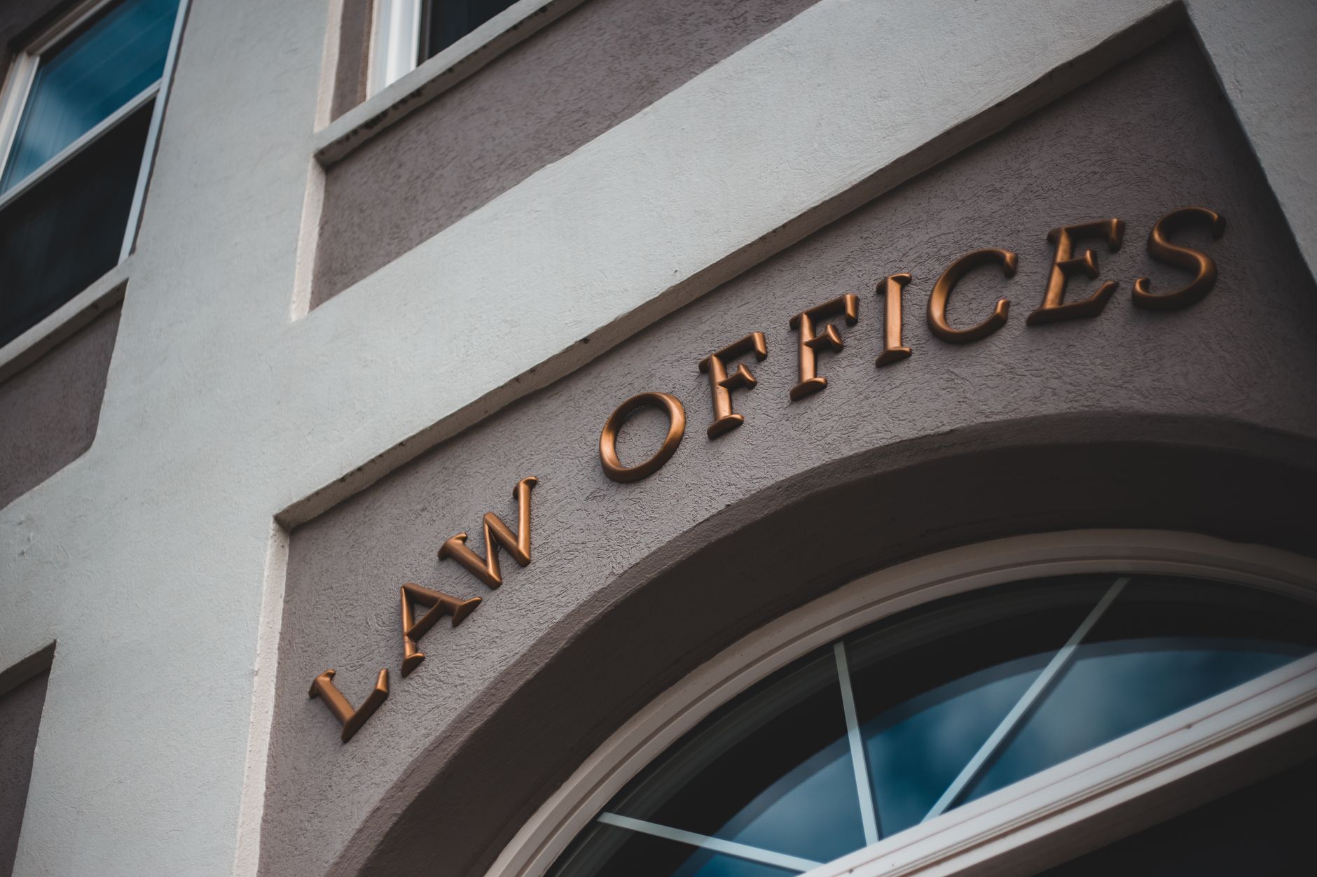 Exterior of a modern law firm office building where professional-services firms operate