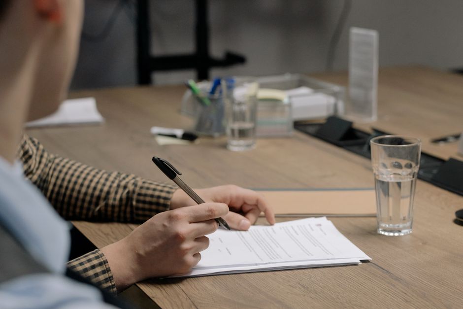 Business owner reviewing a cyber insurance application with security control documentation