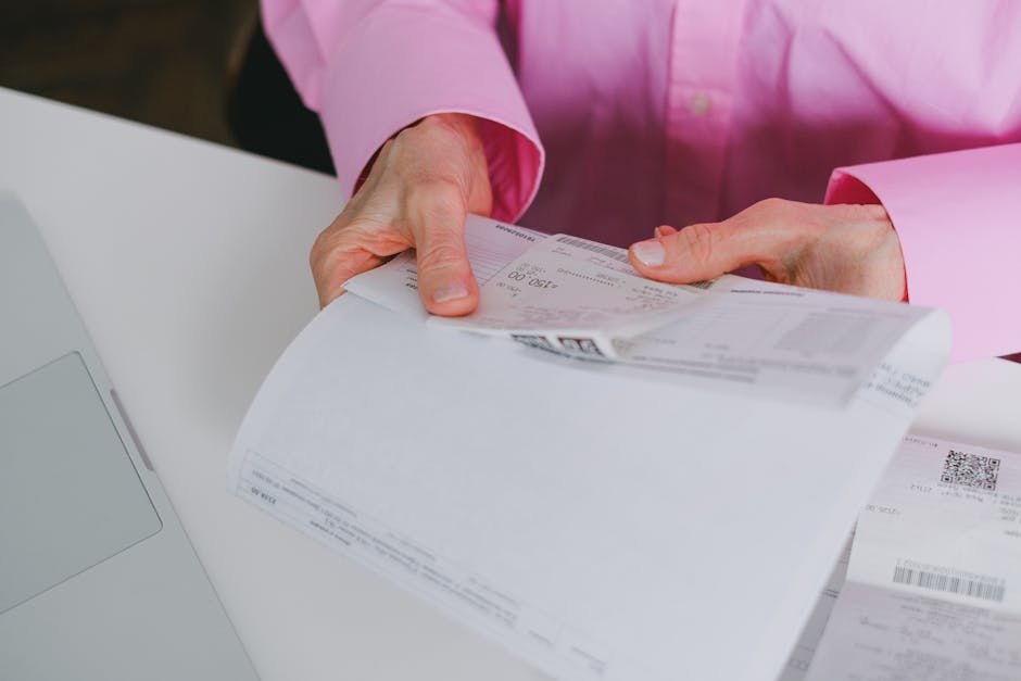 Finance team member reviewing an invoice on a desk in an office