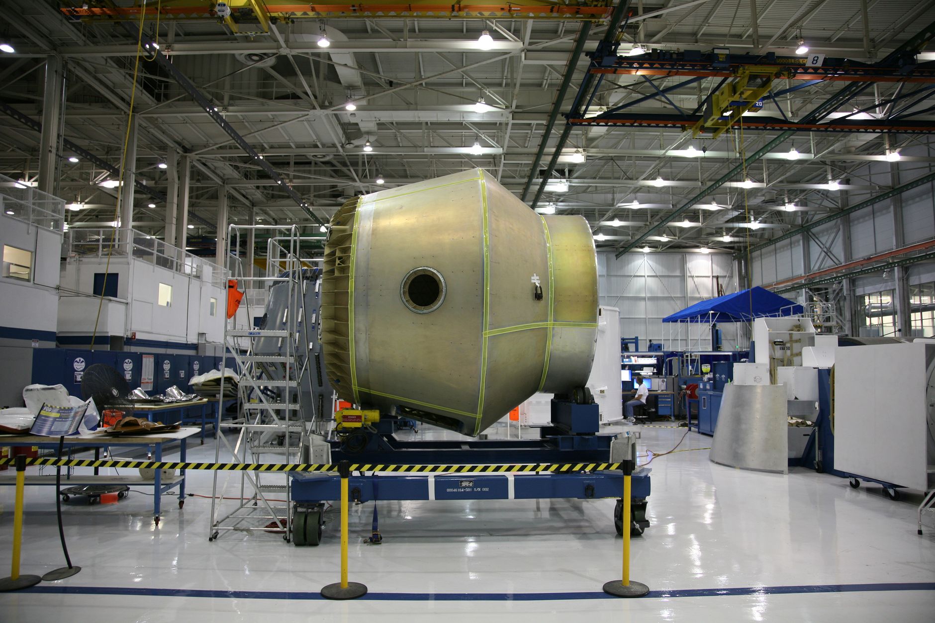 Engineer working in a defense manufacturing facility preparing for CMMC Level 2 assessment