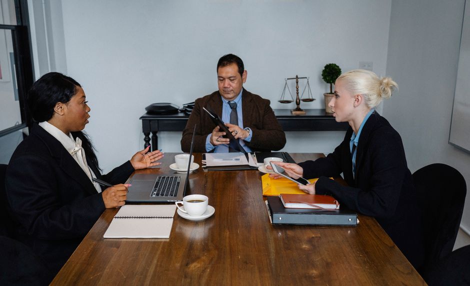 Security and governance team reviewing AI policy implications around a conference table